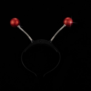 Detail of red sequin alien antenna headband with spring balls and power switch