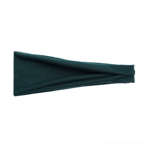 Detailed texture of dark green moisture-wicking elastic headband for yoga and fitness