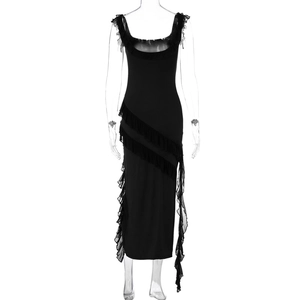 Detail of black sleeveless dress with ruffled edges and asymmetrical slit hem design