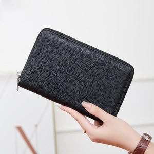 Black leather RFID blocking long wallet with pebble grain texture and secure zipper closure