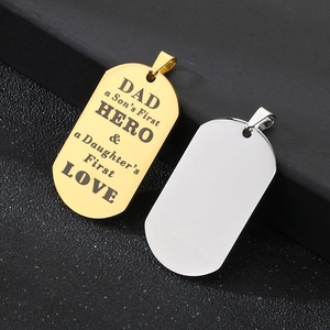 Detail of laser engraved Dad Hero military tags in polished gold and silver steel finishes