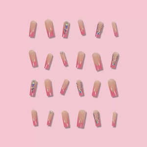 Pink French press-on nails in long coffin shape with rhinestones and silver chains