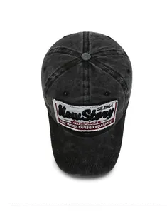 Detailed top view of vintage washed black baseball cap with American style embroidery