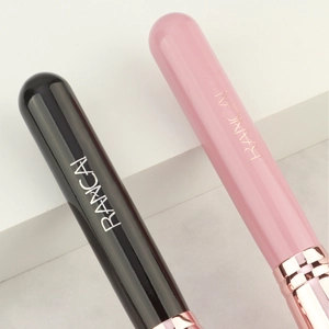 Detail of RANCAI angled foundation brush handles in glossy black and pink with rose gold