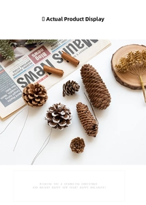 Close-up of natural pine cones with snow effect and wire for DIY Christmas wreaths