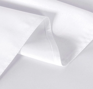 Close-up of white fabric texture showing fine stitching and premium weave detail