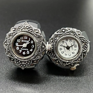 Minimalist quartz finger watch set with metallic engraved bezels in black and white dials