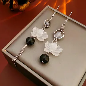 Asymmetric lotus flower beaded earrings with metallic tassel in neo-Chinese style