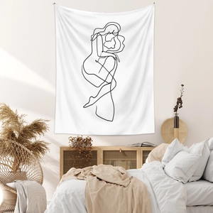 Detail of white line art tapestry with abstract hugging figures in a modern bedroom setting