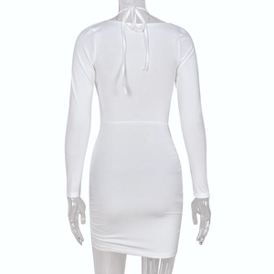 Detail of white long-sleeve backless dress with halter neck tie and slim bodycon fit
