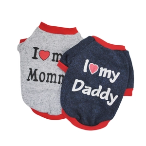 Detail of grey and navy knit dog sweaters with I Love Mommy and Daddy printed text