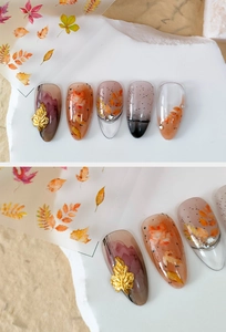 Macro detail of 5D autumn maple leaf nail art stickers with gold foil and resin texture