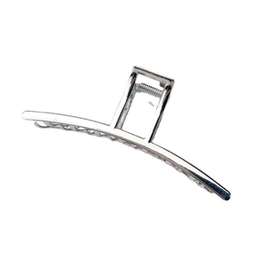 Minimalist silver metal hair claw clip with rectangular hollow handle and mirror finish