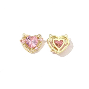 Golden heart-shaped jewelry pendants featuring pink cubic zirconia and hollow back design