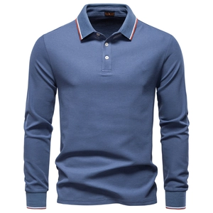 Close-up of blue long-sleeved polo shirt featuring contrast orange and white trim on collar