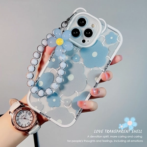 Blue plumeria flower iPhone case with transparent shell and beaded floral strap