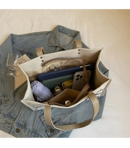 Top view of large capacity canvas tote bag interior showing spacious compartments