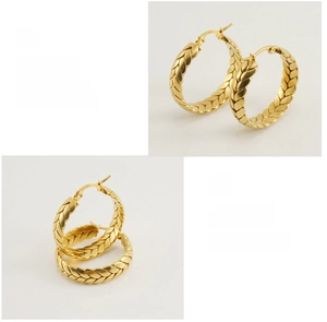 Detail showing the intricate wheat-ear texture on large 18K gold-plated hoop earrings