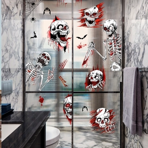 Detailed view of Halloween bloody handprints and skull stickers on a glass shower door