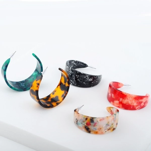 Set of five colorful acrylic C-shape hoop earrings with stylish tortoise and marble patterns