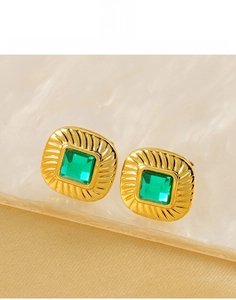 Detailed close-up of square titanium steel earrings with emerald green zircon