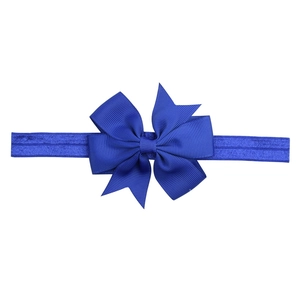 Soft elastic baby headband featuring a blue ribbed grosgrain ribbon bow on white background