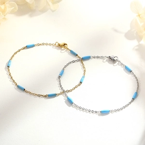 Bracelet chic en acier inoxydable or et argent avec perles cylindriques bleu azur