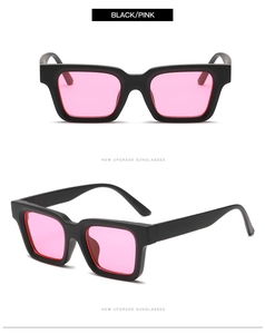 Detail of square black frame sunglasses with transparent pink lenses and thick side temples