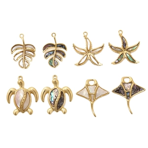 Gold-plated ocean jewelry pendants featuring turtles and starfish with natural shell inlays