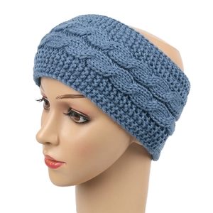Detailed blue cable knit pattern on a warm winter headband for cold weather ear protection