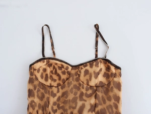 Detail of leopard print camisole with rhinestone straps and sleek satin texture
