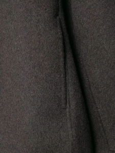 Close-up of premium taupe cashmere fabric showing luxurious texture and fiber detail