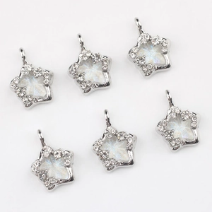 Silver star pendant with sparkling zircons and snowflake resin center for DIY jewelry