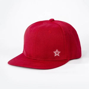 Detail view of a red snapback cap with a white star embroidery and flat brim design