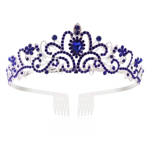 Macro view of bridal crown with deep blue rhinestones and silver metal hair combs