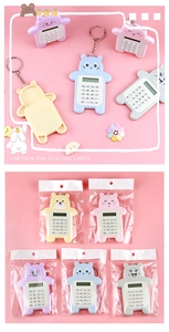 Close-up of cute cartoon bear mini calculators in colorful packaging for students