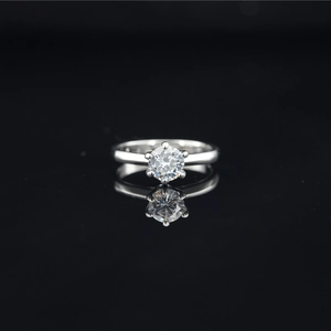 Elegant six-prong moissanite diamond ring in silver titanium steel on reflective black base