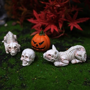 Three-piece Halloween skeleton resin figurines with human skull and animal bones on mossy ground