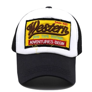 Close-up of vintage Western embroidered patch on white and black mesh trucker hat