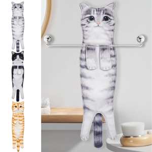Detailed view of striped cat-shaped hanging towels in grey, orange, and tuxedo colors