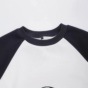 Black and white raglan sleeve sweatshirt with round neck and embroidery detail