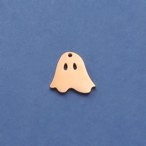 Detailed close-up of a rose gold ghost charm in polished metal for DIY jewelry making