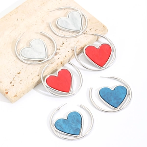 Three pairs of elegant heart-shaped hoop earrings in white, red, and blue colors