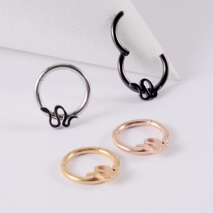 Set of four stainless steel snake shaped hoops in silver black gold and rose gold colors