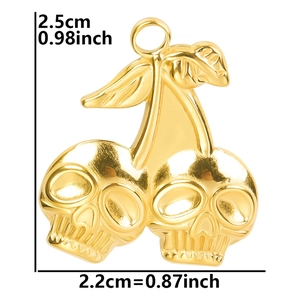 Detail view of gold skull cherry pendant with dimensions 2.5cm by 2.2cm shown on white