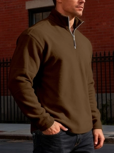 Close-up of men's brown fleece sweatshirt with a 1/4 zipper and standing collar design