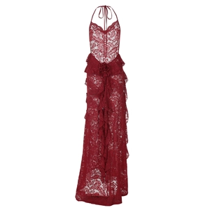 Detailed view of dark red floral lace fabric and elegant ruffled hem of the long dress