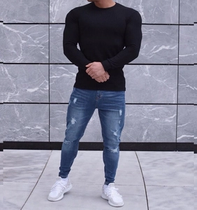 Detail of men's slim fit black ribbed long sleeve T-shirt with vertical texture design
