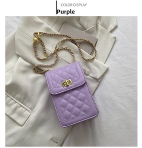 Detail of purple quilted leather phone bag with gold twist lock and chain strap