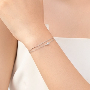 Double-layered S925 sterling silver bracelet with a round zircon stone on female wrist